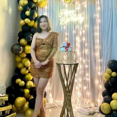 Your birthday should be all about you, shining bright. I designed this chic and modern party backdrop with a black and gold balloon arrangement, a shimmer wall, and a custom neon sign for a glamorous home celebration.