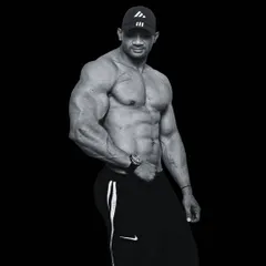 No nonsense, just results. A classic bodybuilding pose showing the muscle mass and symmetry that comes from consistent training.
