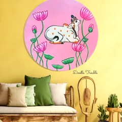 A mock-up of my Pichwai-inspired cow painting in a vibrant, eclectic room. This shows how the artwork's bright pinks and greens can add a playful yet spiritual touch to a colorful interior.