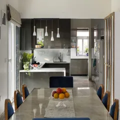 A duplicate of ID 47, this image captures the harmonious blend of the functional kitchen and the elegant dining space, perfect for both everyday meals and entertaining guests.