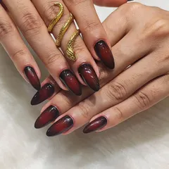 For a look that's both elegant and edgy, I created this stunning aura gradient effect. The design blends a deep burgundy into black on long almond-shaped extensions, creating a sophisticated and dramatic look that's perfect for making a statement.