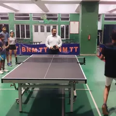 A young player gets ready to return a shot during a practice match at our facility. We provide a safe and encouraging space for kids to learn the basics of table tennis, including proper stance and grip.