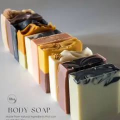 Behold the beautiful diversity of my body soap collection. Each bar is a unique piece of art, formulated with natural, plant-based ingredients to nourish the skin. This lineup shows the variety of colors and textures I can create, all derived from natural sources like mineral clays and botanicals.