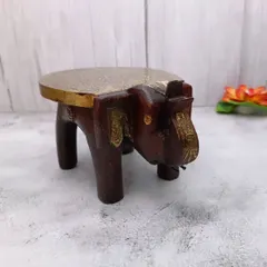 This is my wooden elephant bajoth, or chowki, with a brass top. It is a beautiful and sturdy stand for placing your favorite idols during pooja.