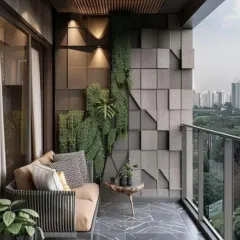 This balcony features a highly textural 3D wall composed of geometric panels and integrated vertical greenery. The design creates a unique, artistic backdrop for the seating area, blending modern architecture with natural elements.