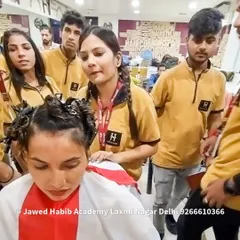 A student practices a haircut on a live model under the watchful eye of our experienced faculty. We provide close supervision to ensure students learn the correct techniques.
