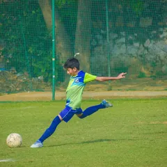Another young athlete mid-kick, demonstrating the skills honed at our academy during the Pride Cup tournament.