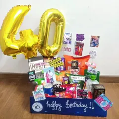 Turning 40 is fabulous, and this hamper is all about celebration. It's packed with snacks, drinks, and fun personal touches, complete with large '40' foil balloons to make a bold and festive statement.