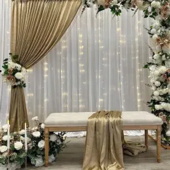 For a more elegant and sophisticated look, I created this stage with a white and gold theme. The setup includes a floral arch, soft drapery with fairy lights, and candle accents for a truly romantic feel.
