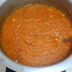 A large pot of Sakkarepongal, or sweet pongal, bubbling away. This shows the scale of my catering for events, where I prepare traditional dishes in bulk without compromising on homemade taste.