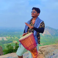 Spreading joy and rhythm with a djembe on the Ramanagara hills. Our treks are not just about silent walking; they are also about celebrating life, sharing positive energy, and finding happiness in simple moments together.