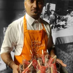 A tray of our handcrafted popsicle cocktails. These are a perfect, refreshing treat for a daytime event or brunch, combining the fun of a popsicle with the sophistication of a well-made cocktail.