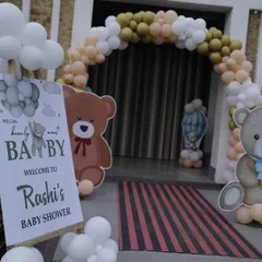 Details matter. This shot shows the personalized welcome sign for Rashi's baby shower, perfectly matching the adorable teddy bear theme and pastel color scheme of the event.