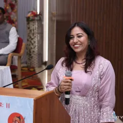 A smiling moment from the stage of the Jain Mewad Bisa Oswal Sangh event. These events are more than a job; they are a way for me to connect with my roots and serve my community.