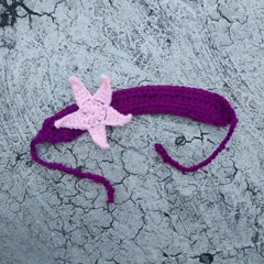 This starfish headband is the perfect accessory for a mermaid or beach-themed outfit. I crafted it with a pink starfish on a purple band, but I can customize the colors for you.