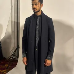 A quick shot against the white studio backdrop backstage before the show begins.