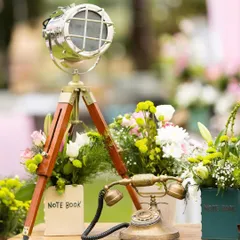 Sometimes the tiniest details make the grandest impressions. This vintage-style decor, featuring an old telephone and a spotlight lamp, added a touch of quirky charm to a welcome brunch.