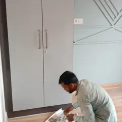 A member of my team at work. We ensure that even the flooring is protected during the finishing process, reflecting my commitment to a clean worksite.