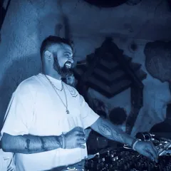 A happy, relaxed shot of me at the decks at Baglami. Not every moment is peak-time intensity; building the groove is just as important.