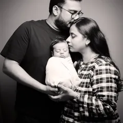 There is nothing more powerful than the love of new parents. This timeless black and white portrait captures that gentle, protective embrace during a newborn family session.