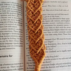 The mustard yellow heart bookmark, showing the repeating pattern of tiny knotted hearts.