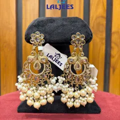 Elegant chandbali earrings with pearl clusters. These are lightweight and can be paired with both traditional and modern outfits.