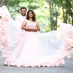This is what spring romance looks like. Our clients are perfectly coordinated in pastel pink for their pre-wedding shoot, with her in a stunning ruffled gown and him in a matching custom suit.