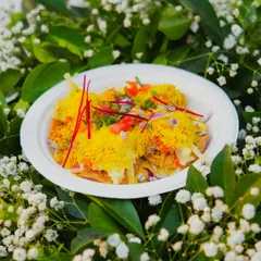 My live chaat counter is always a hit. Here is a plate of freshly made Sev Puri, loaded with crispy sev, tangy chutneys, and fresh toppings for that perfect street-food experience, served hygienically.