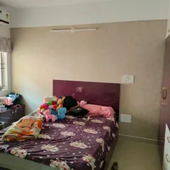 This is another view of a bedroom blind installation in Electronic City, Bangalore. The neutral fabric blind provides a clean finish and works well with the existing room decor.