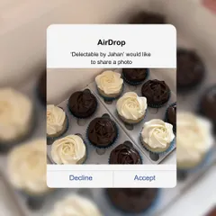 A box of my assorted cupcakes, featuring both vanilla with vanilla buttercream and chocolate with dark chocolate ganache. The simple, elegant rosette piping makes them a crowd-pleaser for any event.