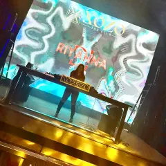 On the main stage at Xozo The Club, surrounded by massive LED screens. This photo captures the scale and visual energy of my performances at large venues.