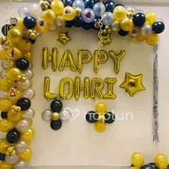 This Lohri decoration uses large "Happy Lohri" foil letter balloons as the centerpiece. I created a balloon arch around it using a classic color combination of yellow, black, and silver to make the message stand out.
