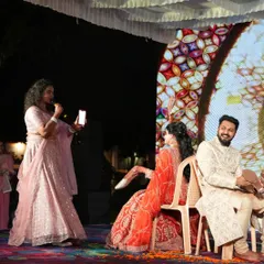 Our host conducting the popular "Shoe Game" with the couple. We plan a variety of games and activities to keep the evening flowing and the guests entertained.