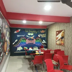 A fun and quirky mural I installed in a cafe. The chalkboard-style art and neon burger are perfect for a casual eatery.