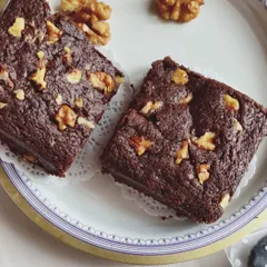 Gooey and delicious Walnut Brownies. These classic fudgy brownies are generously topped with crunchy walnuts for a perfect texture combination.