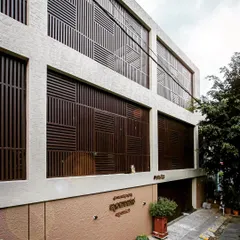A residence in Vijaynagar after our facade renovation. We designed and installed these intricate, geometric screens to completely modernize the building's appearance.