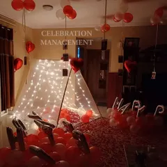 We can set up our beautiful fairy light tents in any part of your home, not just the bedroom. This living room was transformed into a romantic space for a birthday, with the floor covered in rose petals and balloons.