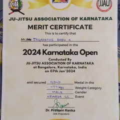 A close-up of the Gold Medal certificate from the Ju-Jitsu Association of Karnataka for the -77kg Gi event. The official proof of a hard-fought victory.