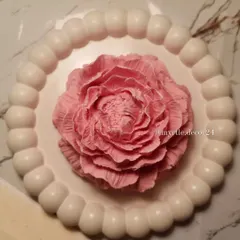 Our Jesmonite Peony aroma diffuser stone. Simply add a few drops of essential oil, and it will naturally release a soothing scent into the air. It's functional decor at its finest.