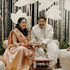 Parents often get their 'second innings' at their children's weddings. This candid shot captures the pure happiness of the bride's parents during the ceremony, dressed in timeless handloom pieces that we helped them select.