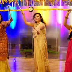 Our students celebrating with dandiya sticks under the festive lights of the studio. The entire space is transformed to create an authentic Garba night experience.