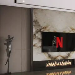 A close-up of a modern media wall featuring a book-matched marble slab and an integrated electric fireplace. This detail highlights our ability to seamlessly blend technology with natural, luxurious materials.
