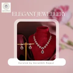 A truly timeless set for those who adore classic beauty. This necklace features a sequence of diamond clusters leading to a pear-shaped sapphire drop, all surrounded by smaller diamonds. The matching drop earrings echo the design, creating a coordinated and sophisticated look.
