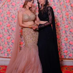 Our client shines in a champagne gold fish-cut lehenga-gown with intricate beadwork. This style is perfect for creating a show-stopping look at a cocktail party or reception.