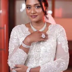 The final portrait of a beautiful Christian bride. Her look is all about soft glam, with defined eyes, a subtle lip, and radiant skin that glows against her intricate white gown.