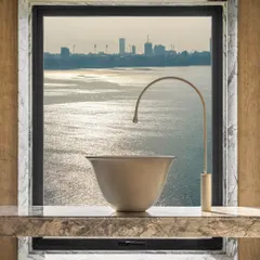 Quiet luxury is in the details. For this Walkeshwar duplex, I framed the stunning bay view with Grey Myst marble, turning a simple window into a living painting. The custom basin and minimalist tap complete this moment of serene elegance.