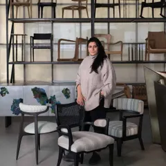 Surrounded by my creations. This is a moment of reflection in the workshop, with a collection of chairs I have designed and built. Each one represents a different exploration of form and material, from classic reinterpretations to modern sculptural pieces.