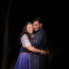 Capturing the pure happiness between a couple on their Dandiya night. Her makeup is kept fresh and luminous, designed to be long-lasting and picture-perfect throughout the entire event.