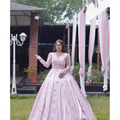 Another angle of the stunning pink gown, highlighting its voluminous skirt and elegant design. It’s a perfect choice for creating unforgettable photos and memories.