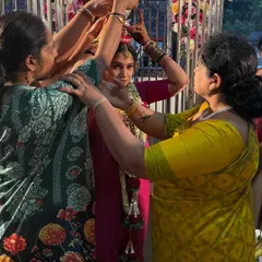 Helping with the bride's preparations. The community and family bonds in our culture are incredibly strong and supportive.